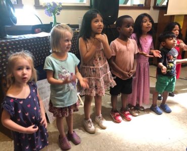 Children standing together in the Koinonia House